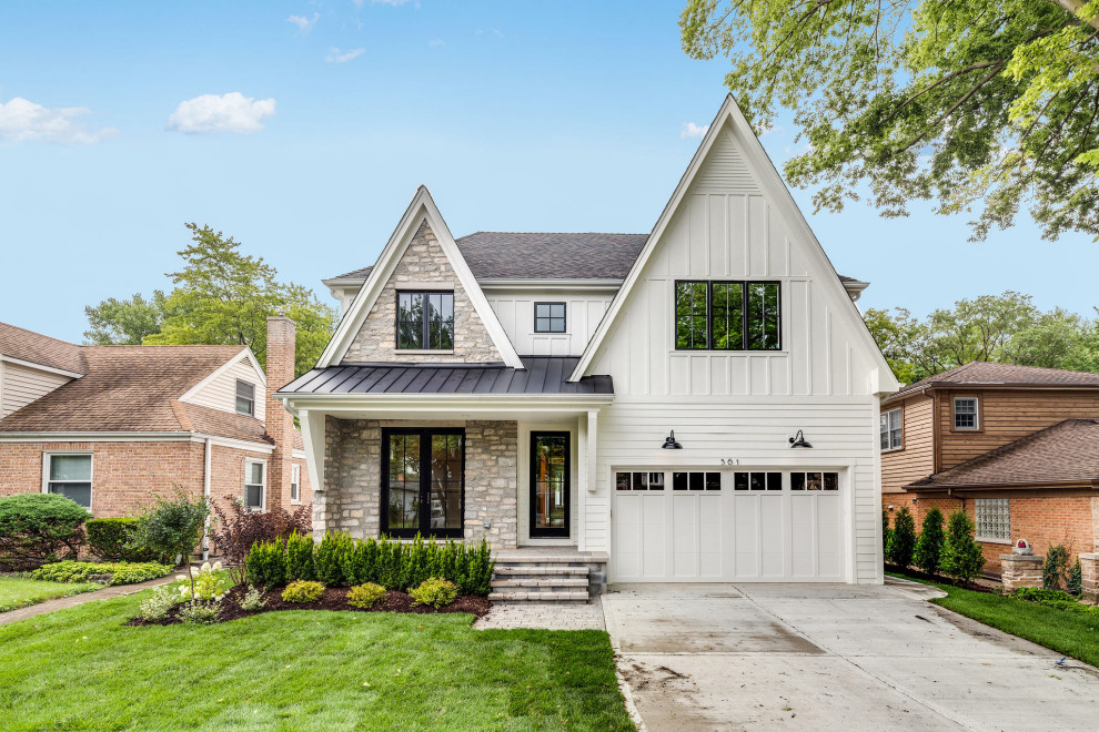 Inspiration for a transitional white two-story mixed siding house exterior remodel in Chicago with a shingle roof