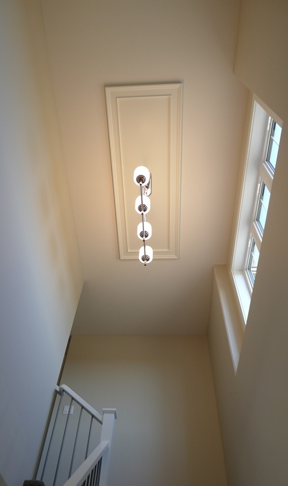 Example of a small transitional carpeted l-shaped staircase design with carpeted risers