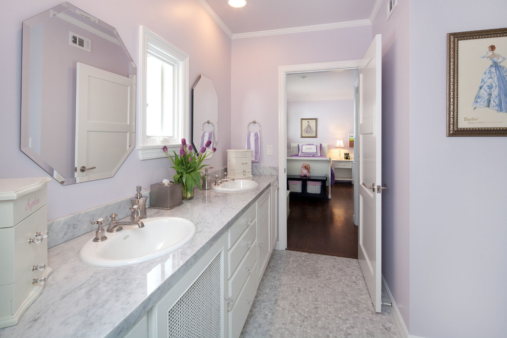 Design ideas for a mid-sized traditional 3/4 bathroom in Los Angeles with flat-panel cabinets, white cabinets, gray tile, ceramic tile, purple walls, marble floors, a drop-in sink and marble benchtops.