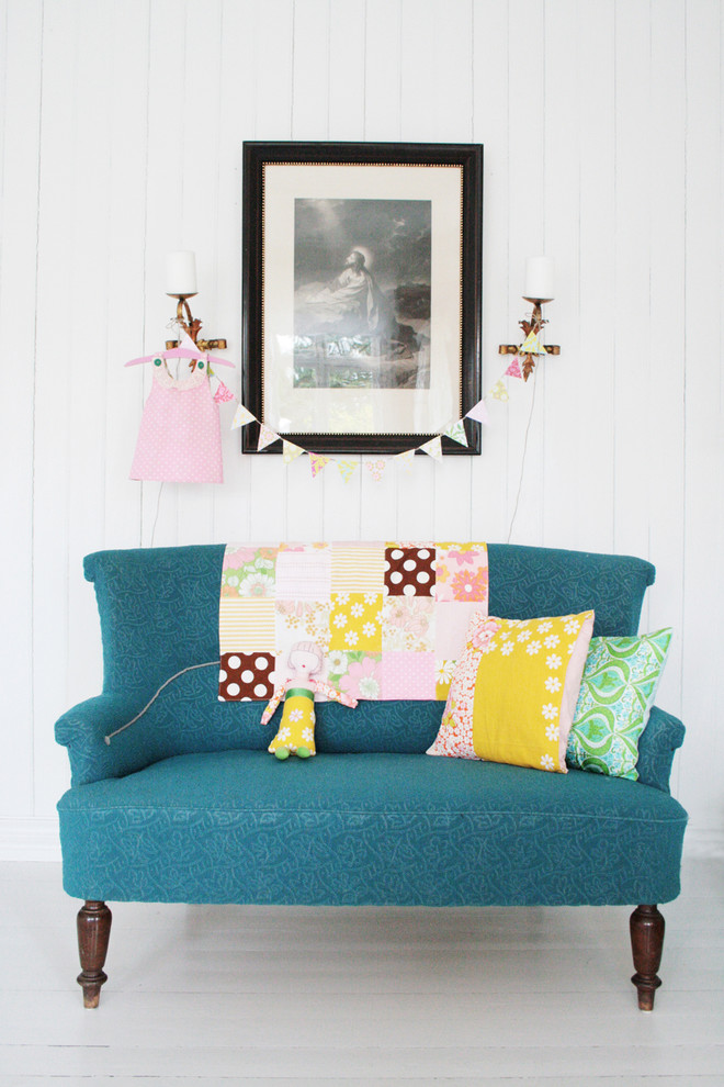 This is an example of a scandinavian living room in Other with white walls.