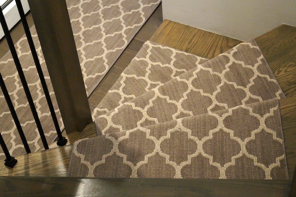 Transitional wooden staircase photo in Cedar Rapids with wooden risers