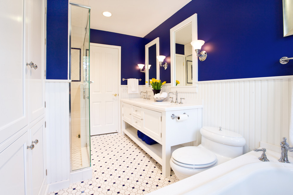 This is an example of a traditional bathroom in Chicago with a double shower and multi-coloured floor.