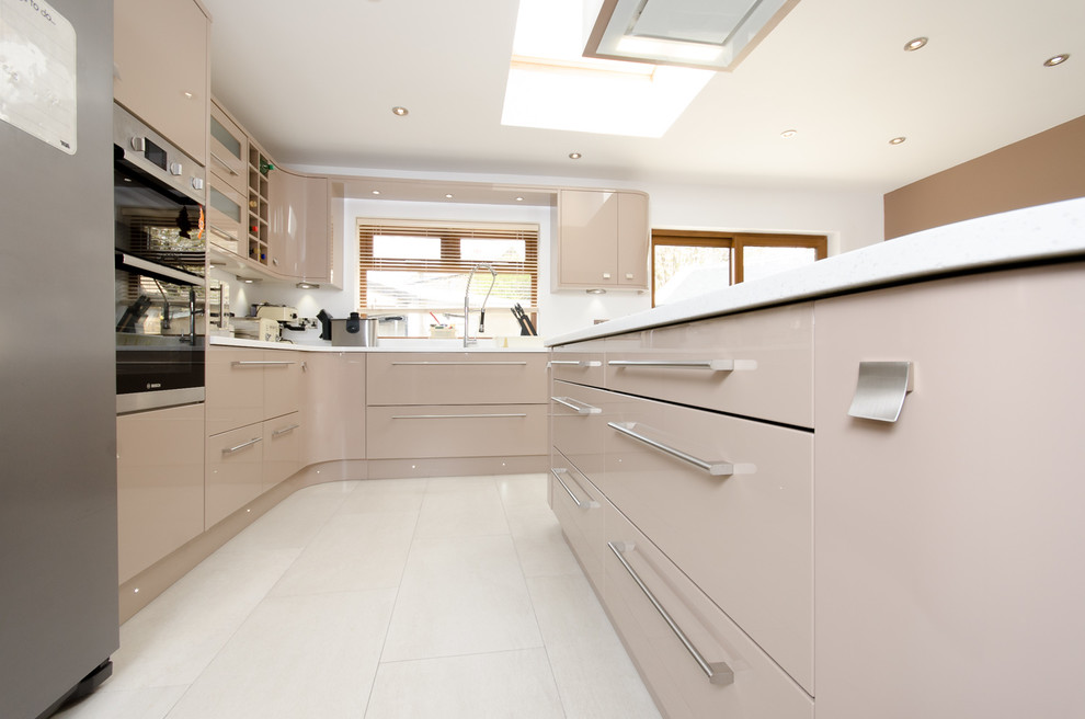 Photo of a large contemporary eat-in kitchen in Other with solid surface benchtops and with island.