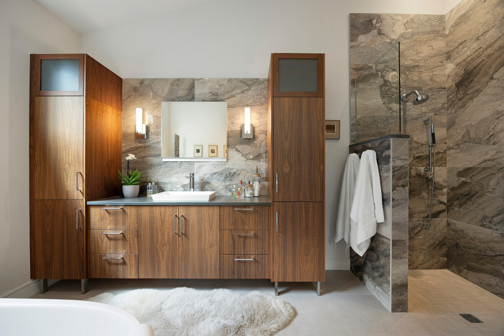 Trendy brown tile gray floor and single-sink bathroom photo in Other with flat-panel cabinets, dark wood cabinets, white walls, a vessel sink, gray countertops and a freestanding vanity