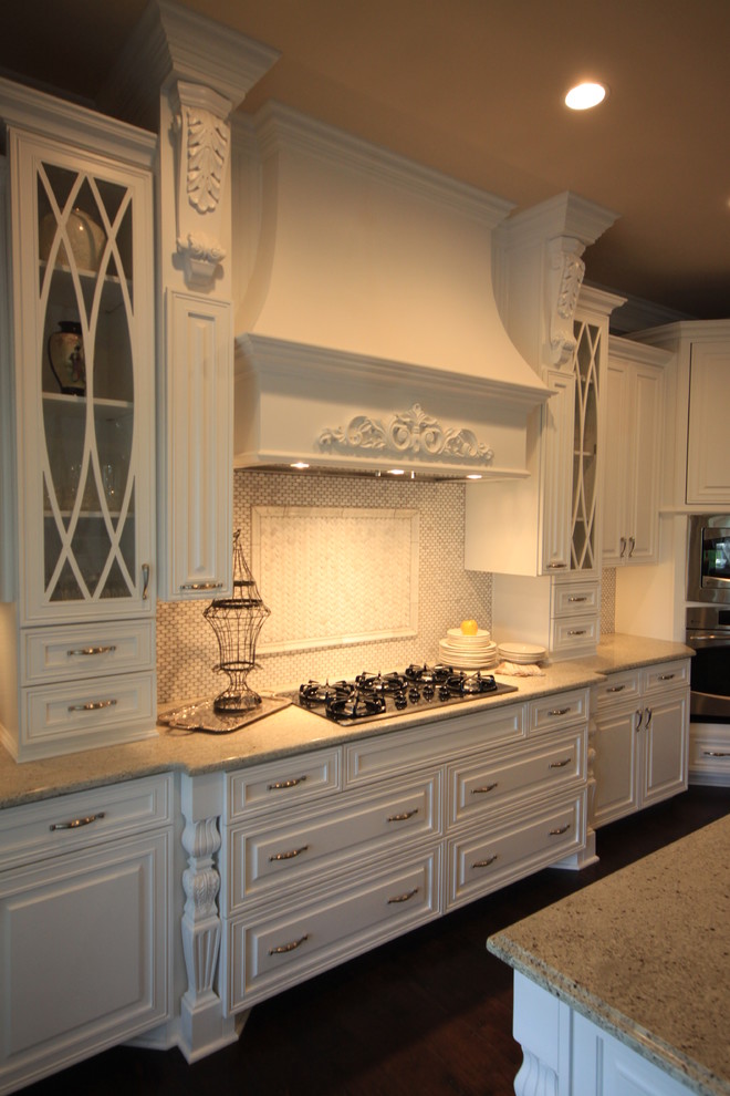 Example of a classic l-shaped open concept kitchen design in Louisville with raised-panel cabinets, white cabinets, granite countertops, stainless steel appliances and an island