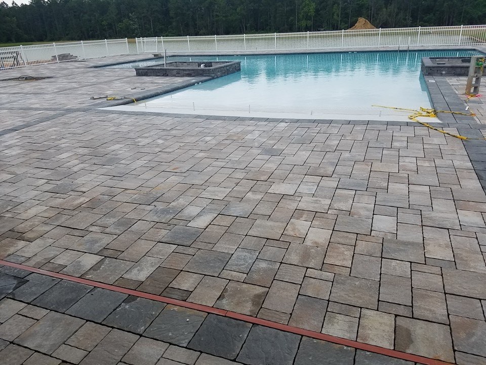 Hot tub - large transitional backyard stone and custom-shaped natural hot tub idea in Miami