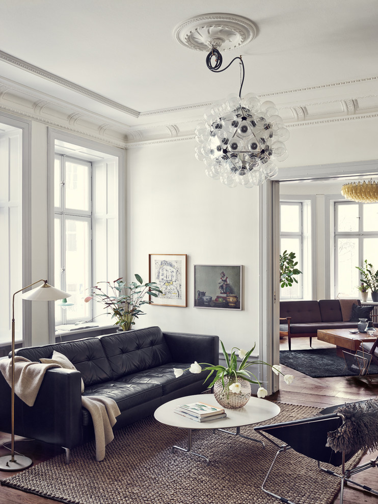 Design ideas for a mid-sized scandinavian formal open concept living room in Stockholm with white walls, no fireplace and no tv.