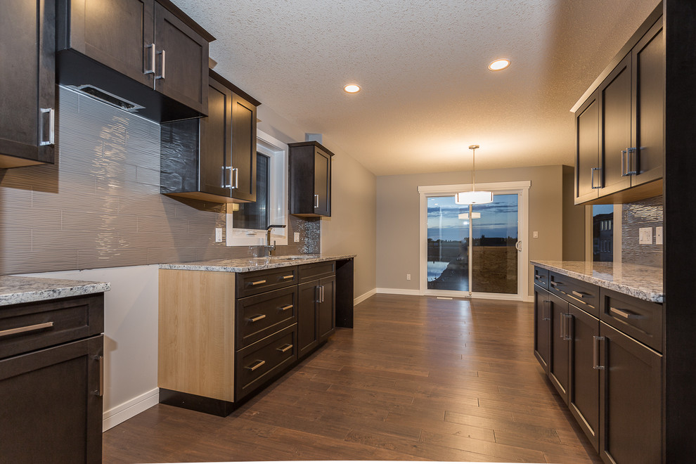 Example of a transitional home design design in Edmonton