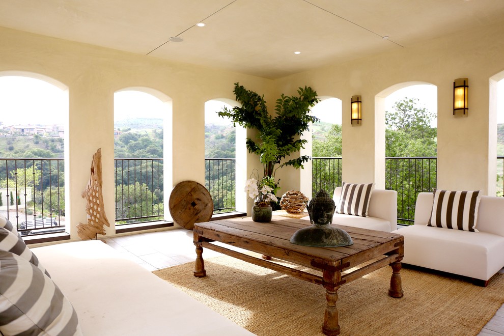 Design ideas for an expansive mediterranean balcony in Los Angeles with a roof extension.