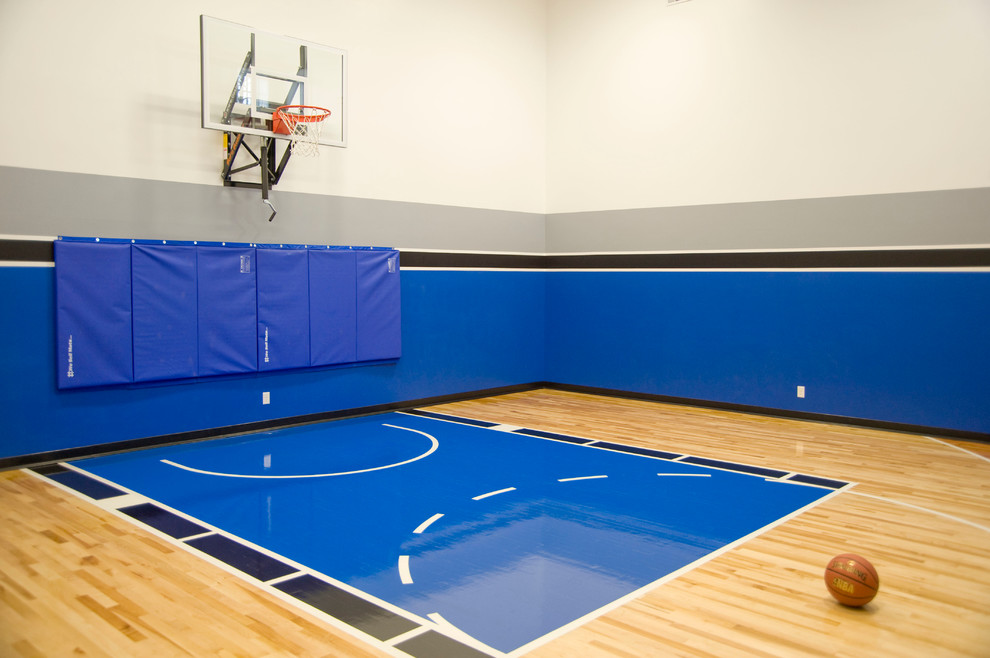 Inspiration for a large traditional indoor sport court in Other with light hardwood floors.