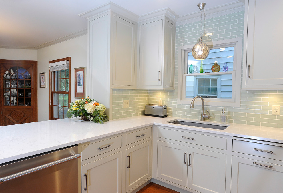 Eat-in kitchen - small transitional u-shaped medium tone wood floor eat-in kitchen idea with an undermount sink, flat-panel cabinets, gray cabinets, quartz countertops, green backsplash, subway tile backsplash, stainless steel appliances and a peninsula