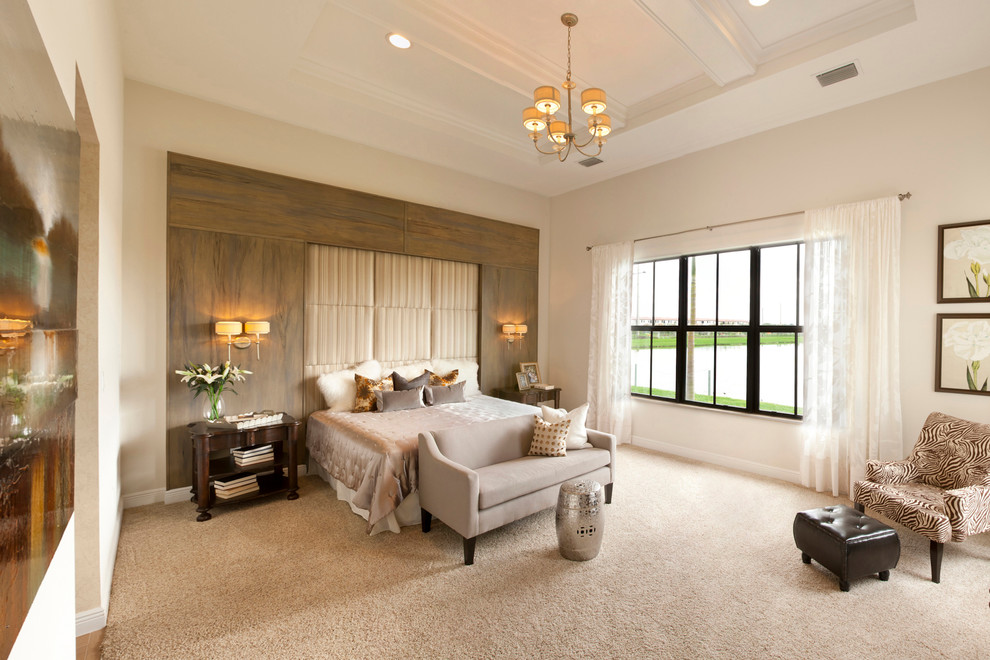 Large contemporary master bedroom in Miami with white walls and carpet.