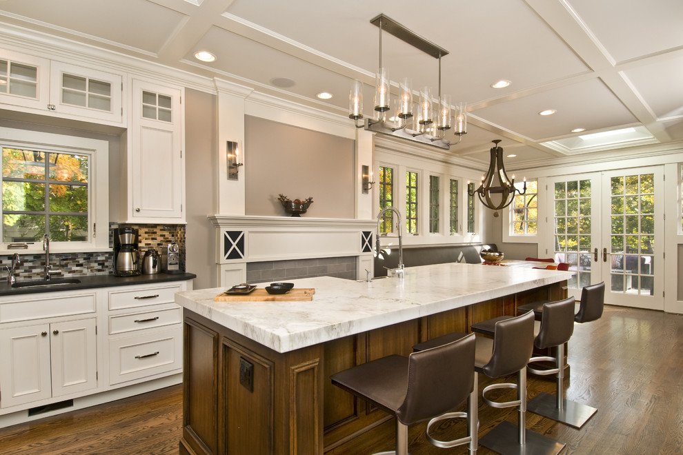 Design ideas for a traditional eat-in kitchen in Newark with beige cabinets.