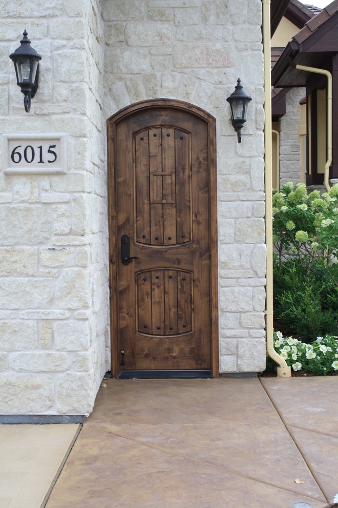 Mudroom - mid-sized rustic mudroom idea in Denver with gray walls and a dark wood front door