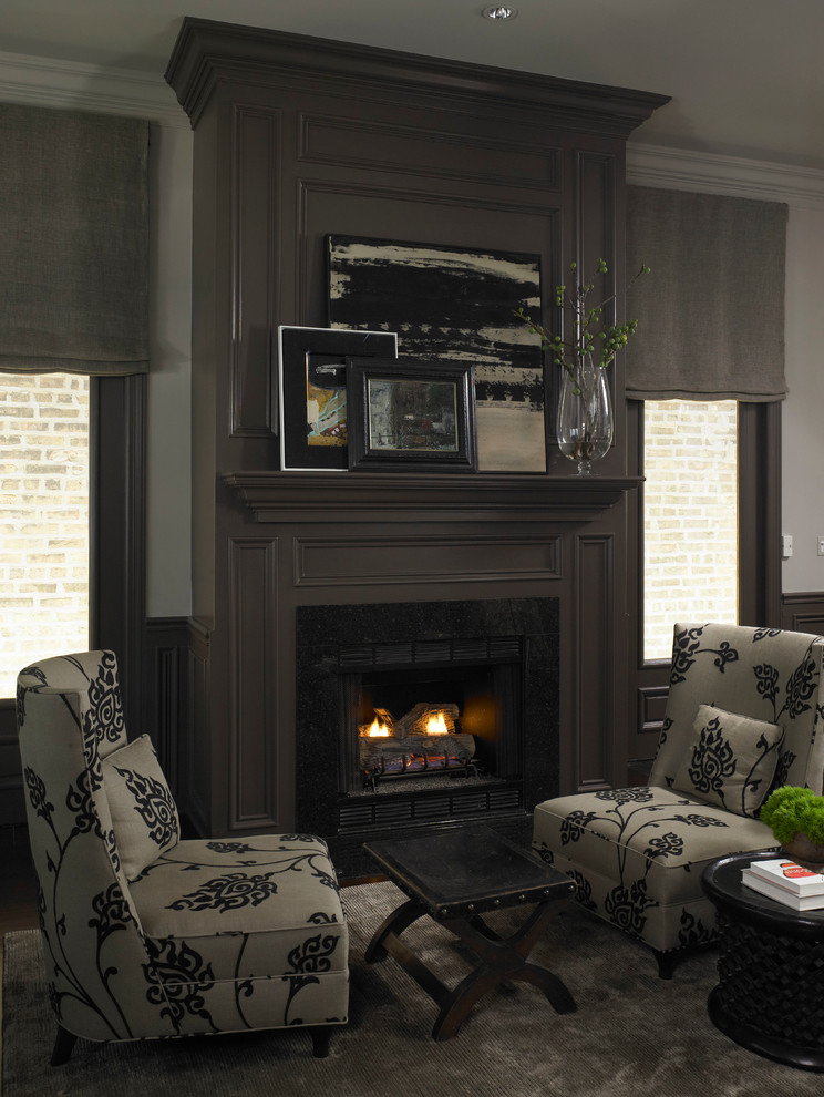 Photo of a mid-sized transitional formal enclosed living room in Chicago with a standard fireplace, no tv, grey walls and carpet.