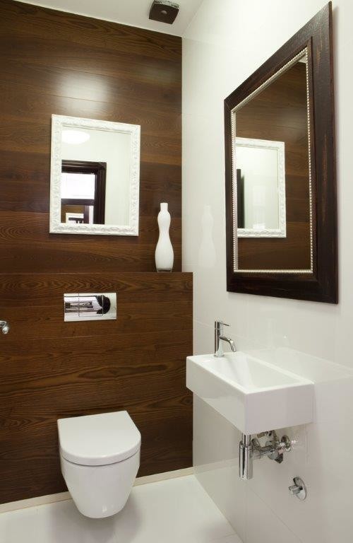 Bathroom - contemporary white tile bathroom idea in Sydney with white walls and a wall-mount toilet