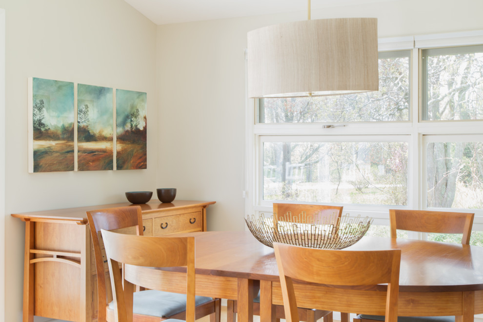 Great room - mid-sized transitional light wood floor great room idea in Providence with beige walls and no fireplace
