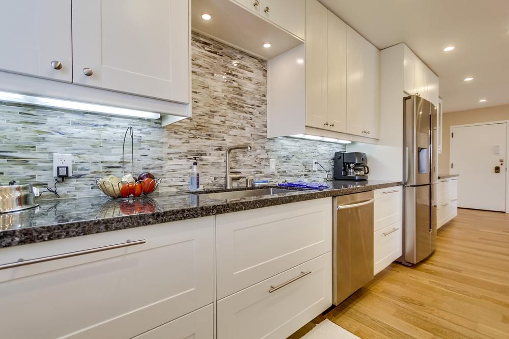 Kitchen on sink side facing entry.