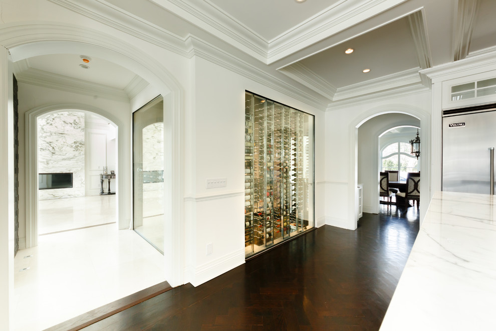 Wine cellar - huge modern marble floor wine cellar idea in New York with display racks