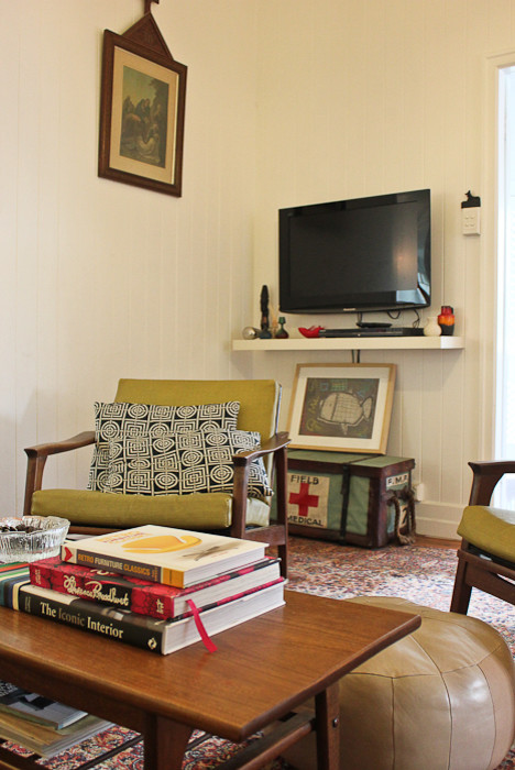 This is an example of a mid-sized eclectic enclosed living room in Brisbane with light hardwood floors.