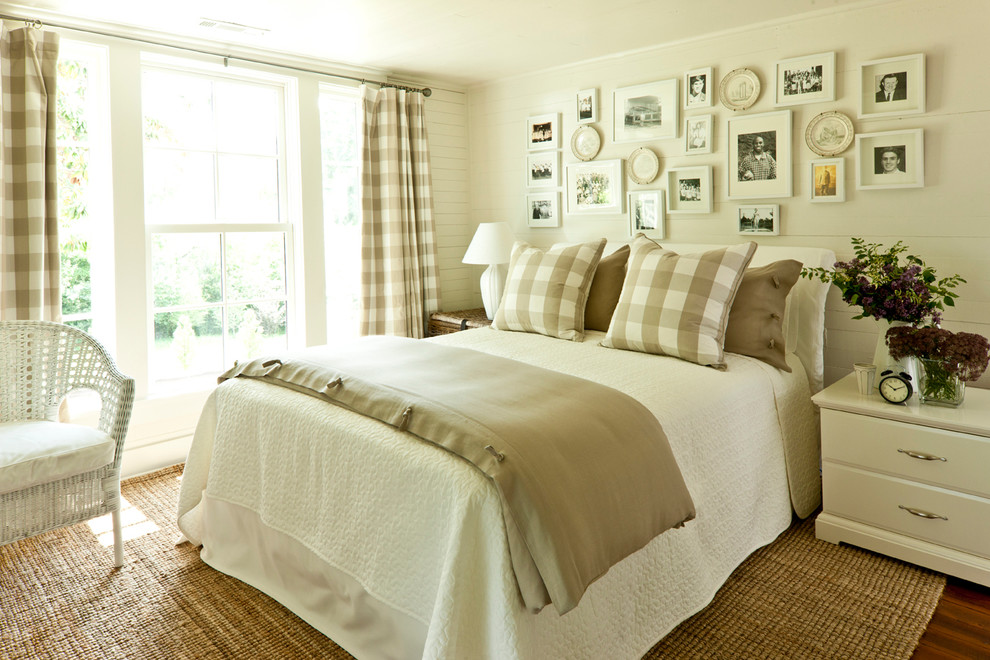 Photo of a country bedroom in Birmingham with beige walls and dark hardwood floors.