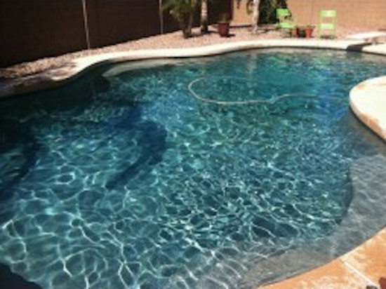 Inspiration for a backyard custom-shaped natural pool remodel in Phoenix