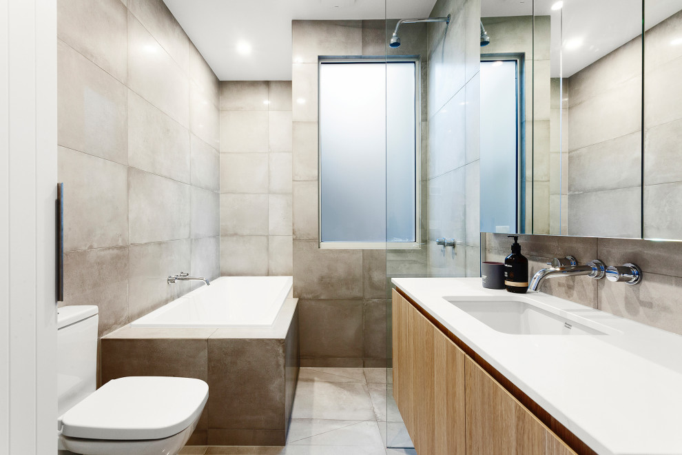 Contemporary master bathroom in Melbourne with flat-panel cabinets, light wood cabinets, a corner shower, gray tile, grey walls, engineered quartz benchtops, an open shower, white benchtops, a single vanity and a floating vanity.