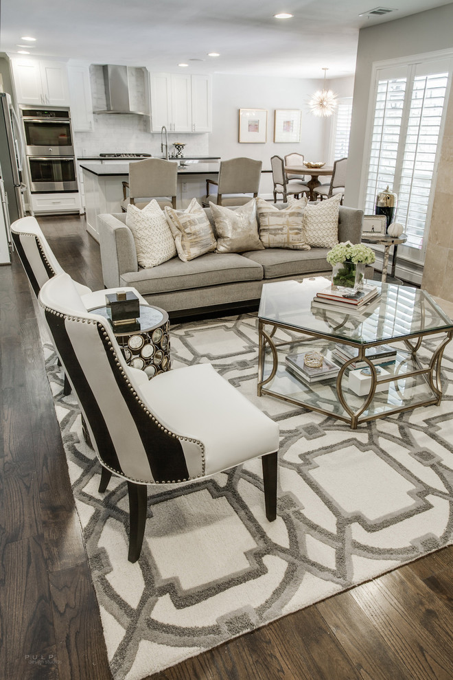 Inspiration for a large transitional open concept family room in Dallas with grey walls, dark hardwood floors, no fireplace and no tv.