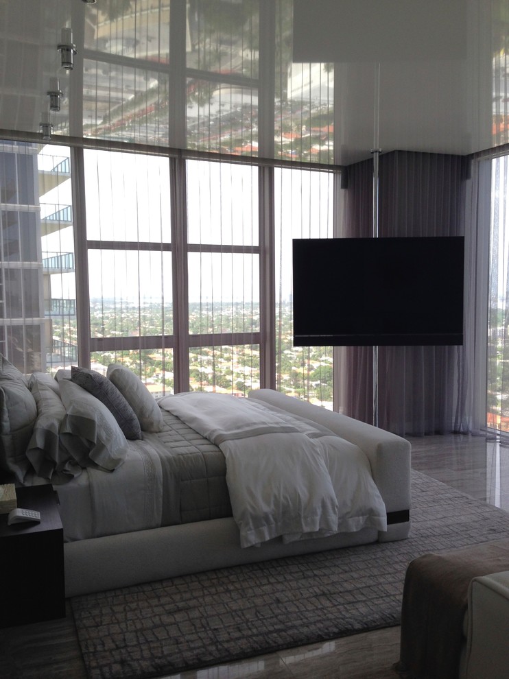 Mid-sized modern master bedroom in Miami with grey walls, marble floors and no fireplace.