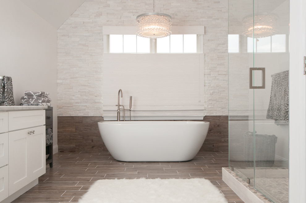 Design ideas for a transitional bathroom in DC Metro with a freestanding tub.