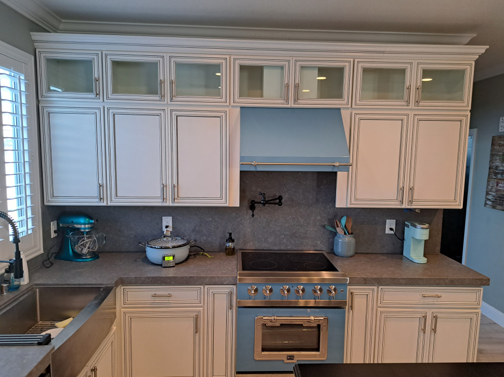 Inspiration for a large transitional kitchen in Las Vegas with recessed-panel cabinets, quartz benchtops, blue splashback, engineered quartz splashback and blue benchtop.