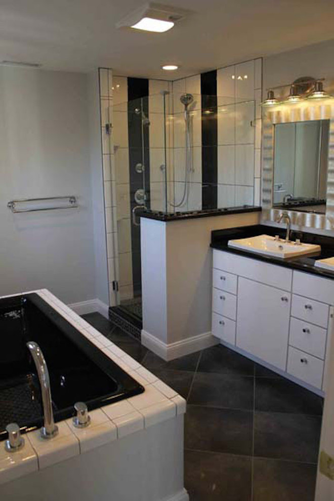 Slate floor doorless shower photo in New York with blue walls
