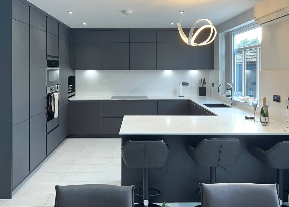This is an example of a medium sized contemporary u-shaped kitchen/diner in London.