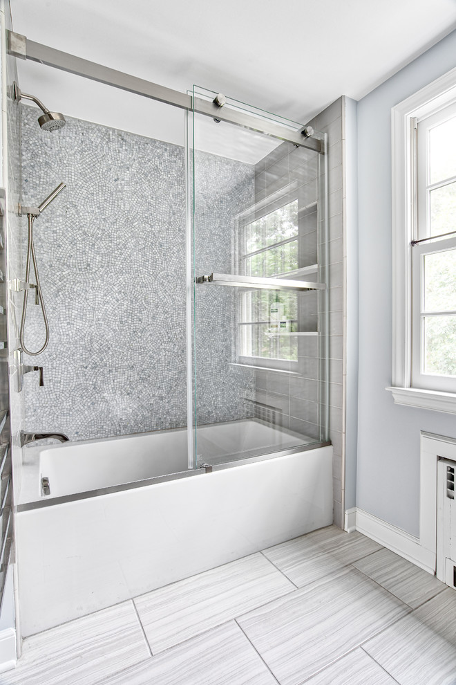 Inspiration for a mid-sized transitional kids bathroom in New York with shaker cabinets, a drop-in tub, a shower/bathtub combo, a two-piece toilet, mosaic tile, purple walls, an undermount sink, a sliding shower screen and white benchtops.