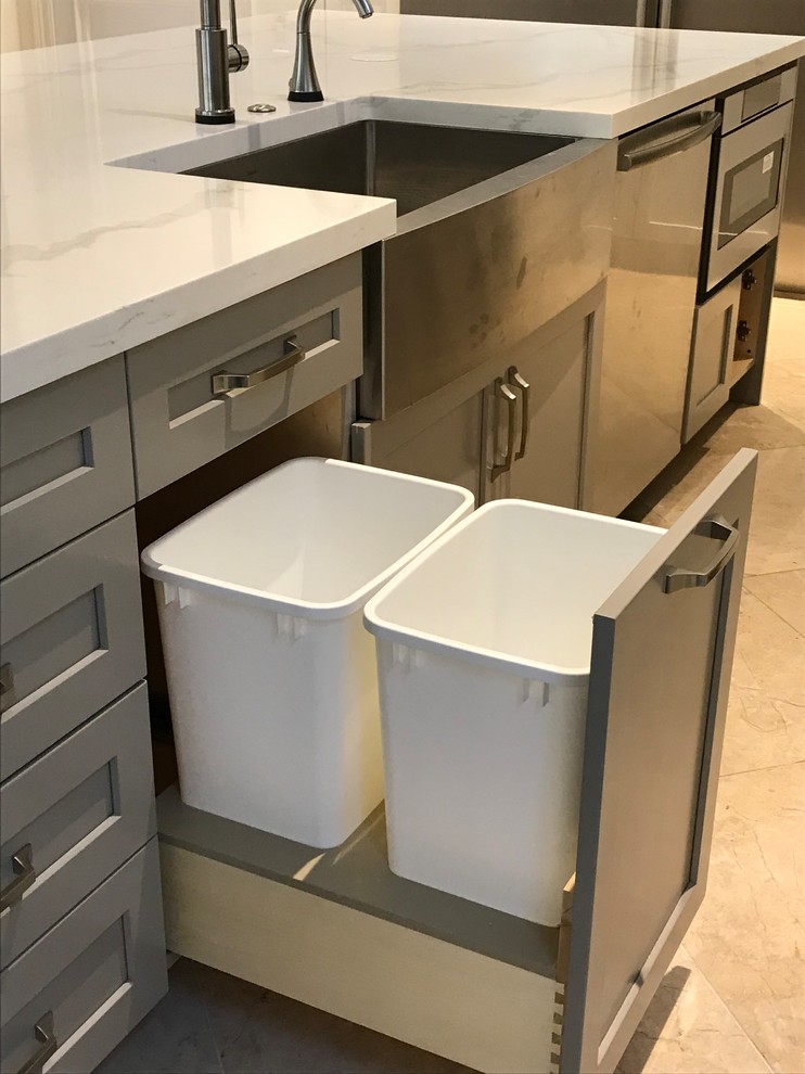 Large transitional kitchen photo in Miami with a farmhouse sink, shaker cabinets, white cabinets, quartz countertops, gray backsplash, glass tile backsplash, stainless steel appliances, an island and multicolored countertops