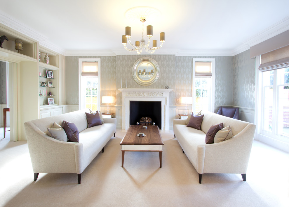 Inspiration for a traditional formal living room in London with grey walls, a standard fireplace and no tv.