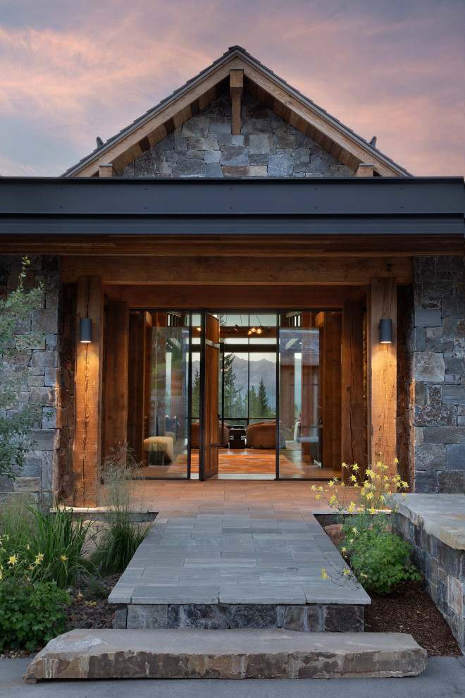 Inspiration for a rustic pivot front door remodel with a medium wood front door