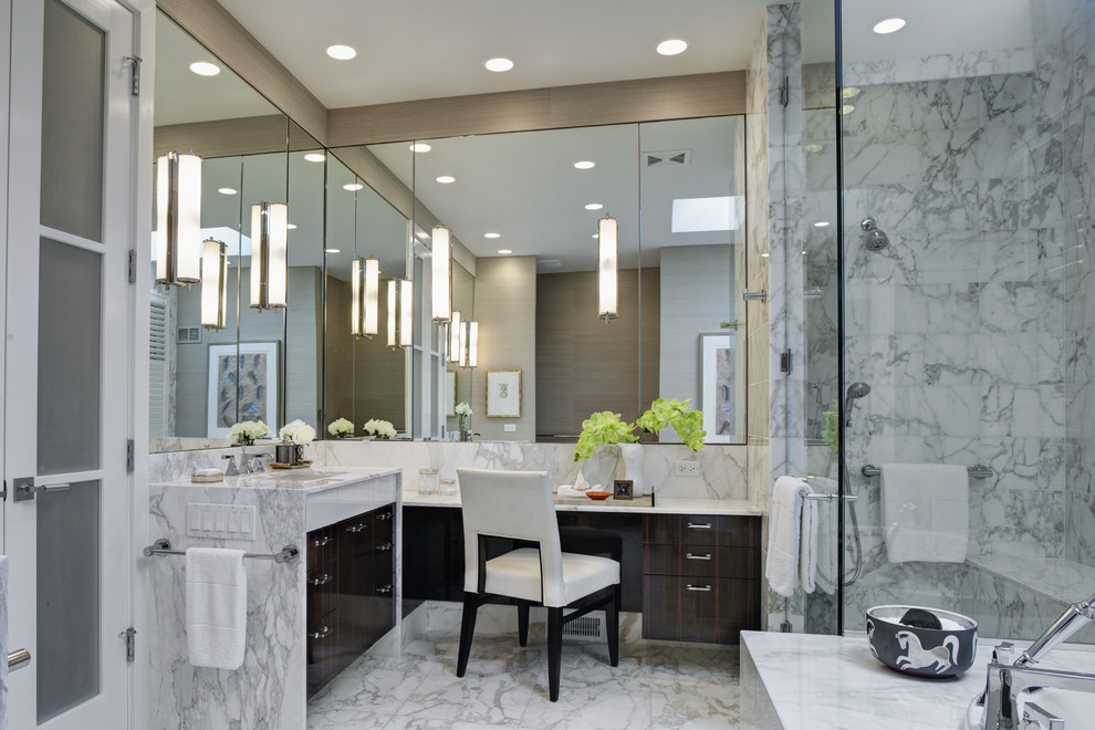 This is an example of a contemporary bathroom in Chicago with marble benchtops.