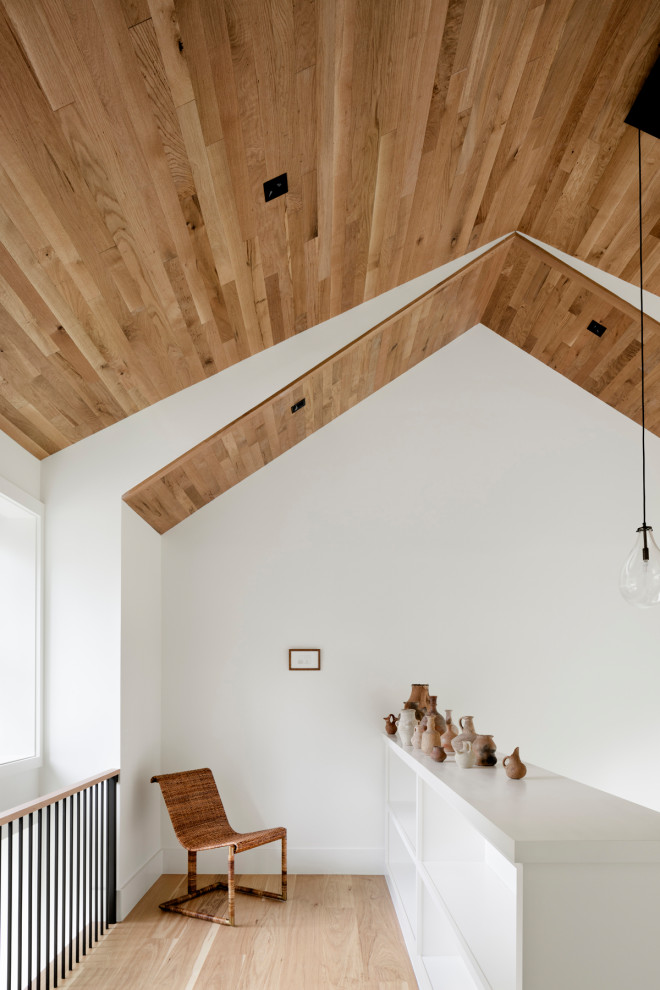 Large cottage light wood floor, beige floor and wood ceiling hallway photo in DC Metro with white walls