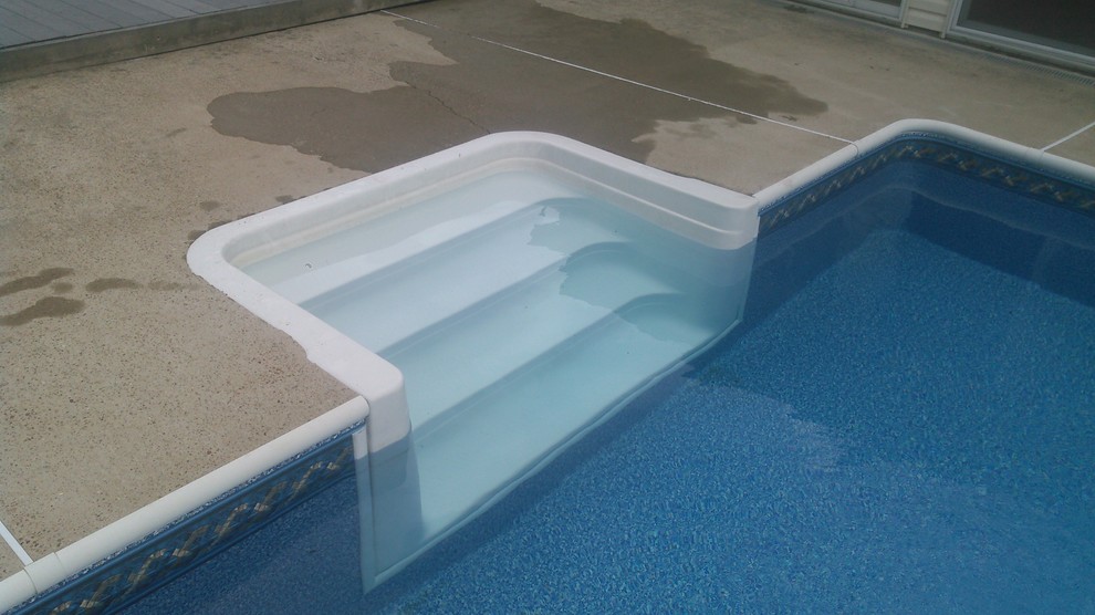 Inspiration for a mid-sized contemporary backyard concrete paver pool remodel
