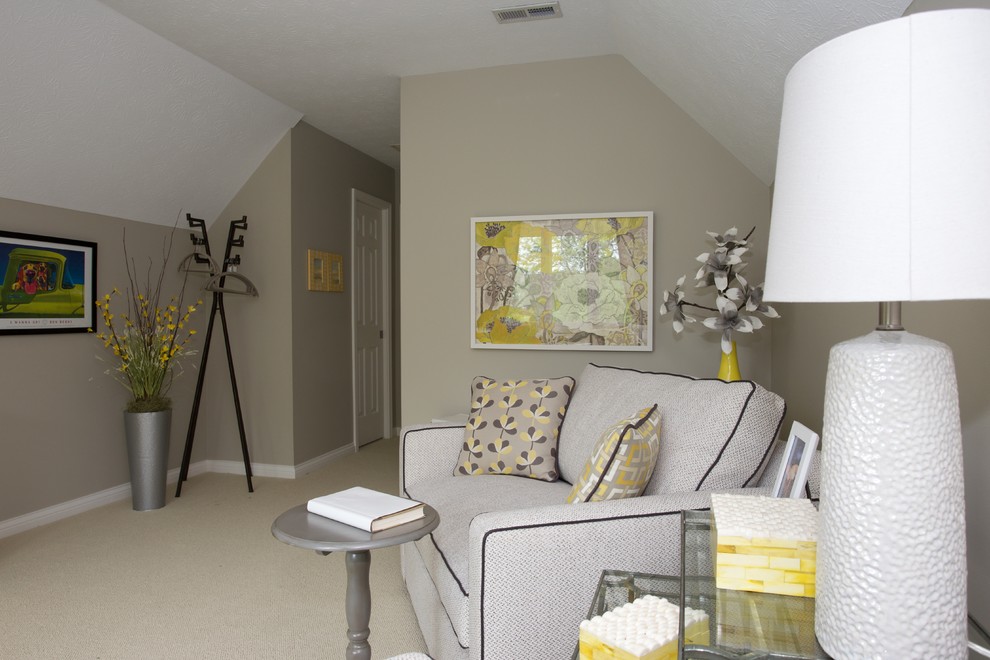 Transitional family room in Indianapolis with grey walls and a freestanding tv.