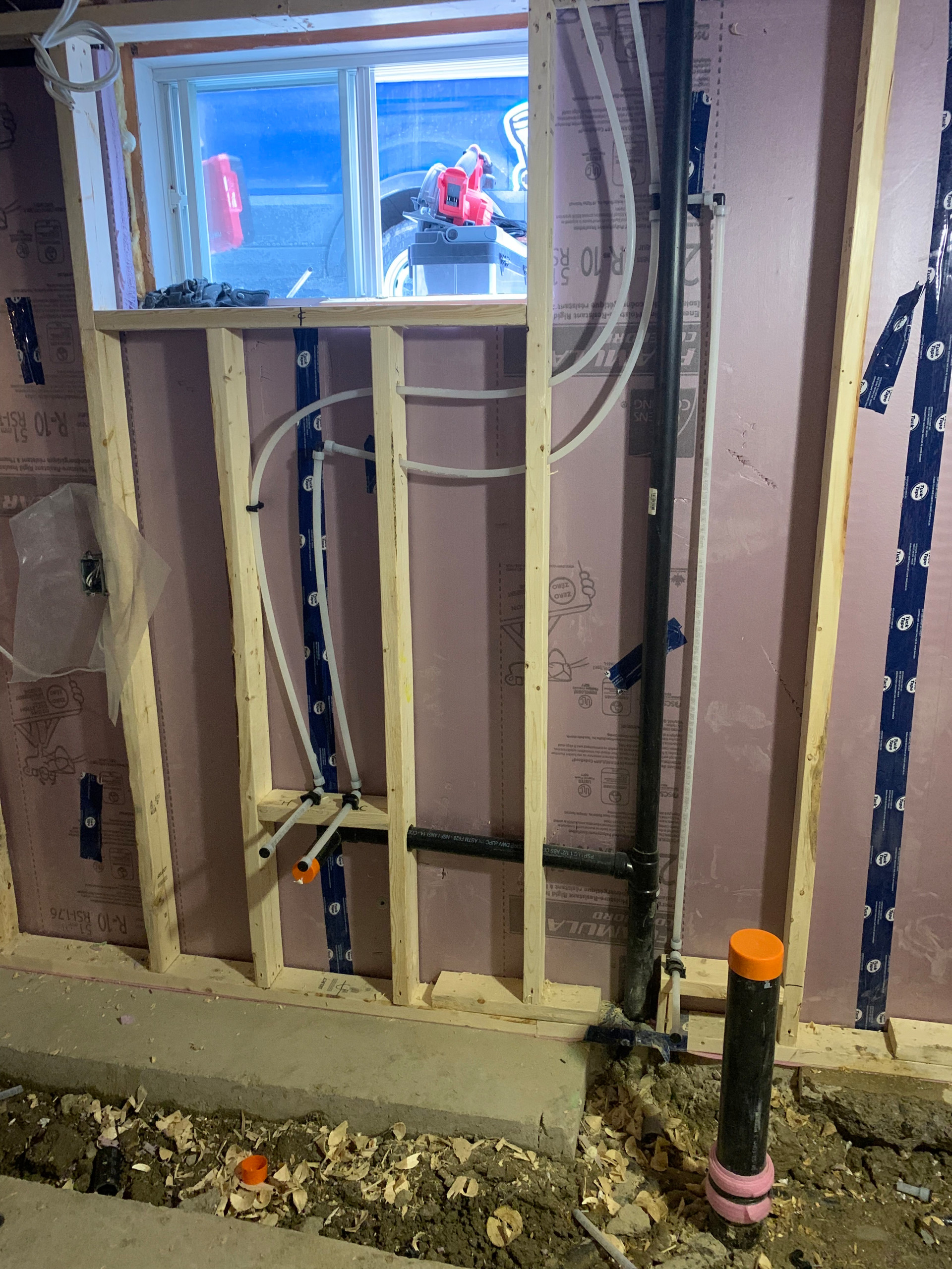 Tile install process including under tile waterproofing