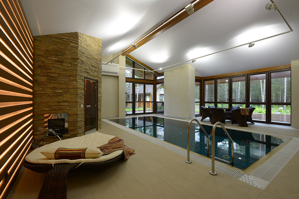 Design ideas for a mid-sized contemporary indoor rectangular pool in Novosibirsk with tile.