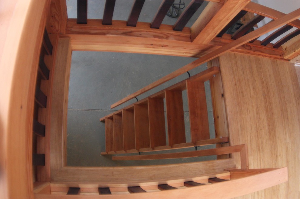 Inspiration for a small modern wood straight staircase in Portland with open risers.