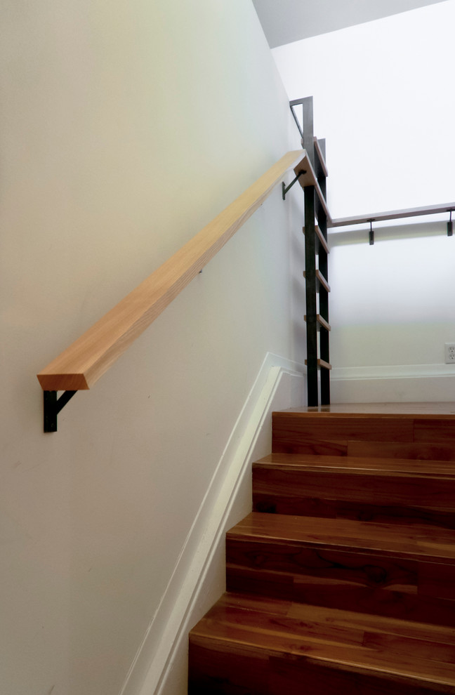 This is an example of a small midcentury u-shaped staircase in Other.