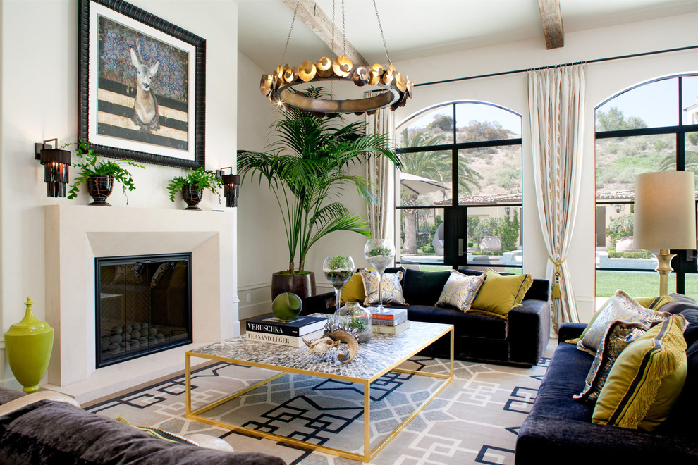 Transitional family room in Los Angeles with white walls and a standard fireplace.