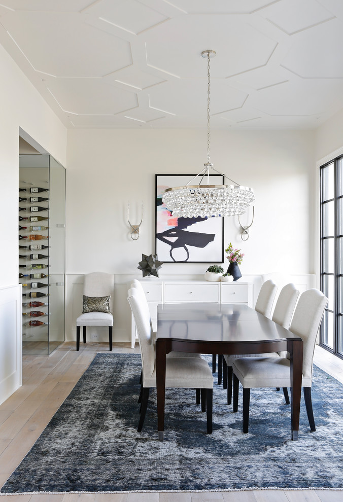 Inspiration for a transitional dining room in Nashville with white walls and light hardwood floors.