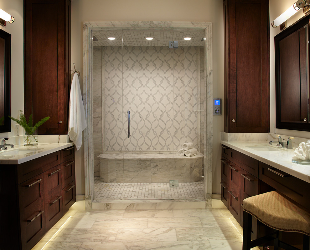 This is an example of a large tropical master bathroom in Tampa with an undermount sink, shaker cabinets, dark wood cabinets, white tile, stone tile, marble benchtops, white walls and marble floors.
