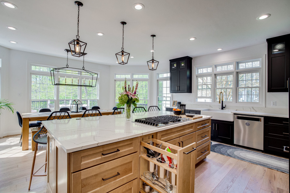 Eat-in kitchen - large transitional u-shaped eat-in kitchen idea in DC Metro with a farmhouse sink, quartz countertops, stainless steel appliances and an island