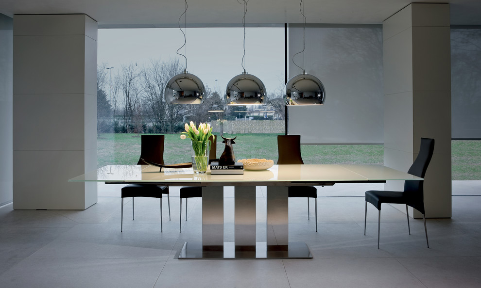 Modern dining room in Philadelphia with grey walls and concrete floors.